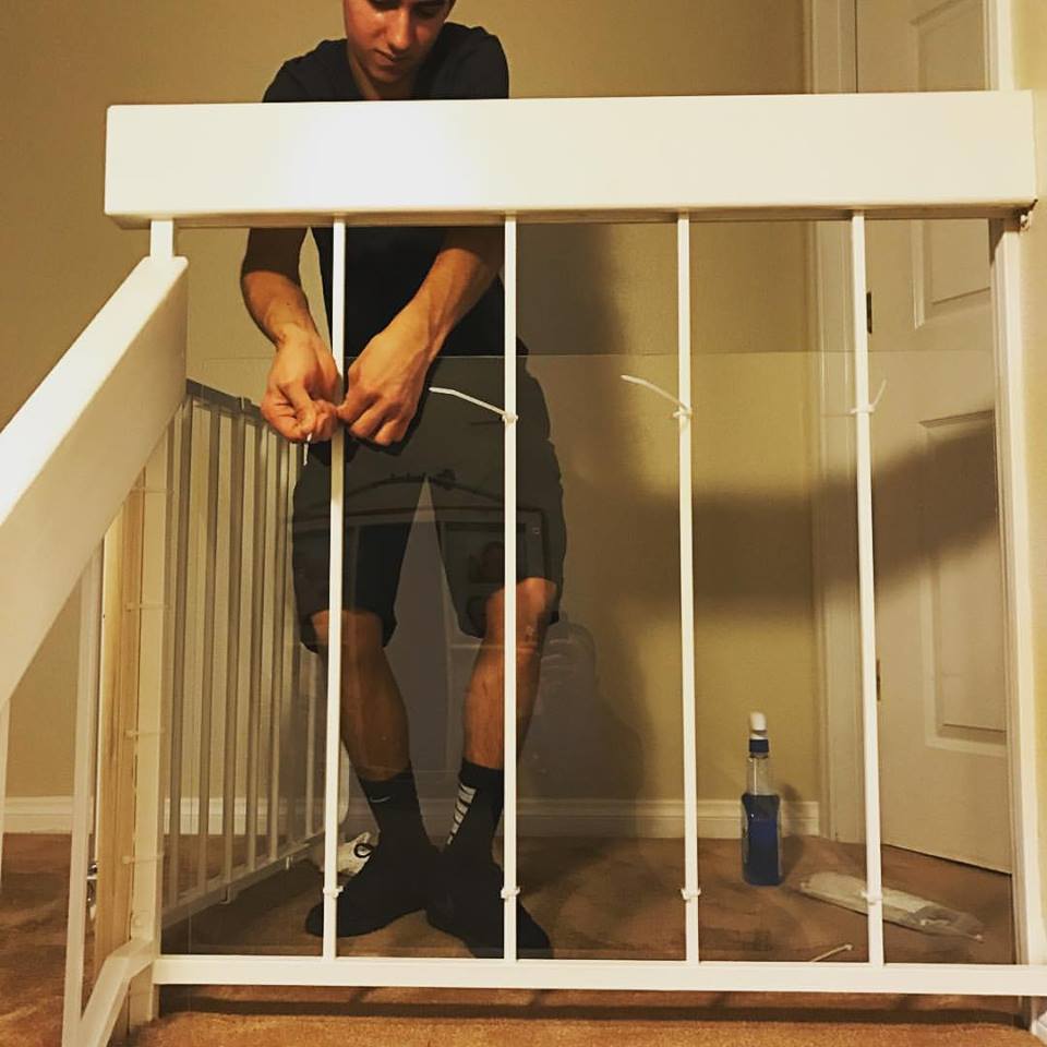Baby safety installation on stair banister
