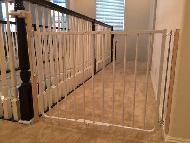 Baby gate placed by Baby Safe Homes at the top of the stairs