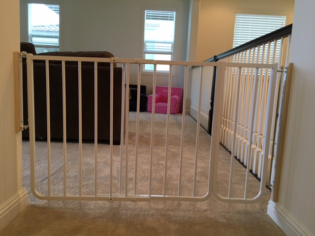 Baby proof baby gate placed at the entrance of the playroom by Baby Safe Homes