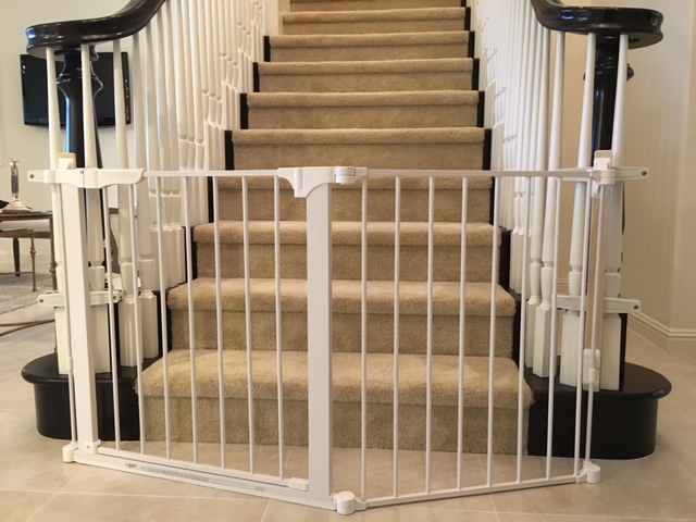 Custom sectional baby proof baby gate for extra wide opening at the bottom of the stairs placed by Baby Safe Homes