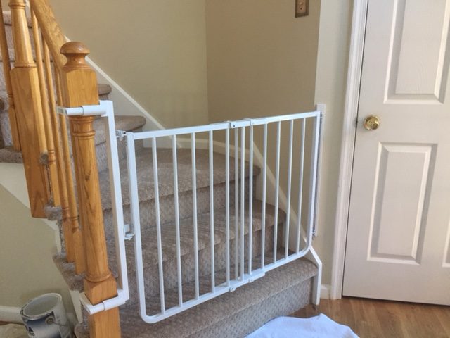 Baby gate with no hole clamps installed by baby safe homes in new jersey